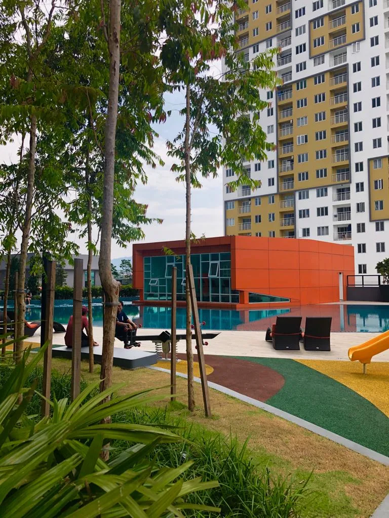 Pool and orange clubhouse at The Holmes